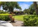 Lush backyard with mature landscaping and privacy, creating a serene outdoor living space at 3950 Pepper Ln, North Port, FL 34287