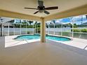 Sparkling pool surrounded by a screened enclosure providing a serene outdoor oasis for relaxation and recreation at 4103 Kinlock St, North Port, FL 34286