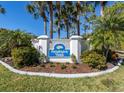 Welcome to Farmington Vistas sign, nestled amongst swaying palm trees and greenery at 421 Cerromar Ter # 471, Venice, FL 34293