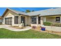 Inviting front exterior of home showcasing a manicured lawn and attractive entryway at 5832 Monroe Rd, Venice, FL 34293