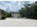 Detached garage that features an exterior of horizontal siding at 5850 Saddle Oak Trl, Sarasota, FL 34241