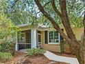 View of the exterior featuring a screened porch and walkway at 912 Barclay Ct, Venice, FL 34293