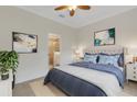 Comfortable main bedroom with a neutral color palette and en-suite bathroom at 9823 Haze Dr, Venice, FL 34292