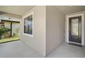 Inviting front entrance featuring a stylish door with decorative glass and a covered porch area at 12014 Creek Preserve Dr, Riverview, FL 33579