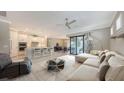 Bright and airy living room showcasing an open concept, seamlessly connecting living, kitchen and dining area at 1481 Hyssop Loop, North Port, FL 34289