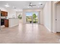 Inviting living space with tile floors, natural light, and seamless access to the outdoors at 1493 Maseno Dr, Venice, FL 34292
