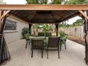 Cozy backyard patio featuring an outdoor dining set under a gazebo at 161 Suntan Ave, Sarasota, FL 34237