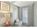 Inviting foyer with decorative accents and a stylish lamp at 318 Venice East Blvd, Venice, FL 34293
