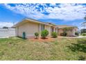 A house with a well-maintained lawn and privacy fence at 3851 Sterling Rd, Venice, FL 34293