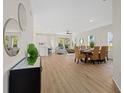 Open-concept living area with a dining table and a view into the kitchen at 4390 Asteria Ter, North Port, FL 34287