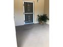 Balcony with a security door and a potted plant at 512 W Venice Ave # 205, Venice, FL 34285