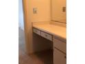 Bathroom vanity with drawers, cabinets, and a mirror above the vanity at 512 W Venice Ave # 205, Venice, FL 34285