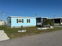 Sweet home features nice landscaping, complemented by a well-maintained lawn at 56 Lakeview Dr, North Port, FL 34287