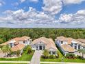 Aerial view of the home showcasing its location, tile roof, and beautiful landscaping at 9048 Luna Ln, Sarasota, FL 34241