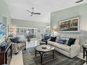 Inviting living room featuring neutral walls, tile floors and comfortable seating arrangement at 114 Southampton N Pl # 237, Venice, FL 34293