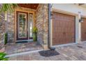 Inviting front entrance featuring a decorative glass door and brick accents at 209 E Venice Ave, Venice, FL 34285