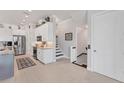 Bright, modern kitchen with white cabinetry and stainless steel appliances at 209 E Venice Ave, Venice, FL 34285