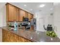 Kitchen featuring brown granite countertops and stainless steel appliances at 2104 Batello Dr, Venice, FL 34292