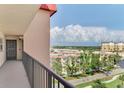 Inviting hallway with scenic neighborhood views offers a glimpse of the serene surroundings at 232 Saint Augustine Ave # 701, Venice, FL 34285
