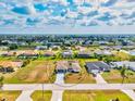 Aerial view of the property highlighting the surrounding neighborhood and community at 269 Mark Twain Ln, Rotonda West, FL 33947