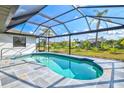 Enclosed pool with a screened enclosure, offering a private and relaxing outdoor space at 269 Mark Twain Ln, Rotonda West, FL 33947