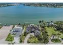 Aerial view of waterfront home showcasing the property's private dock at 333 Sunrise Dr, Nokomis, FL 34275