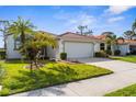 Charming single-story home with two-car garage, landscaped lawn, and beautiful curb appeal at 4378 Summertree Rd, Venice, FL 34293