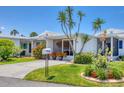 Charming single Gathering home with beautiful landscaping, well manicured yard, and lovely curb appeal at 608 Fair Winds Dr # 608, Nokomis, FL 34275
