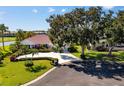 Beautiful single-story home with manicured landscaping and well-maintained lawn at 838 Carnoustie Dr, Venice, FL 34293