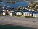 Aerial view of Bahia Mar condo near the beach, offering stunning waterfront views and easy access at 1100 Tarpon Center Dr # 503 5C, Venice, FL 34285