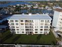 Bahia Mar condo building boasting balconies, manicured lawn, and well-maintained landscaping at 1100 Tarpon Center Dr # 503 5C, Venice, FL 34285