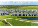Beautiful aerial view of condo with golf course and water view at 12390 Wellen Golf St # 203, Venice, FL 34293