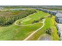 Scenic aerial view of the lush, well-maintained golf course near residences at 12390 Wellen Golf St # 203, Venice, FL 34293