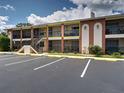 Condo building view showcasing the brick accents and private balconies at 1531 Placida Rd # 202 Building 9, Englewood, FL 34223