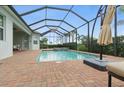 Lovely brick paver pool deck includes a screened lanai, perfect for outdoor entertaining at 15336 Spanish Point Dr, Port Charlotte, FL 33981
