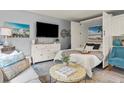 Comfortable living space featuring a cozy bed, sleek furniture, and coastal-inspired decor for relaxation at 1555 Tarpon Center Dr # G 235, Venice, FL 34285