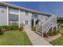 Two-story condo building with well-manicured lawn, shrubbery and easy stair access at 25050 Sandhill Blvd # 6A3, Punta Gorda, FL 33983