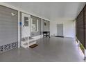 Spacious carport featuring a covered area, exterior door, and access to the main house at 349 Mariner Dr, North Port, FL 34287