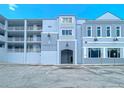 Exterior shot of the Harbor Villas at Dona Bay, showing the building's entrance at 516 Tamiami S Trl # 303, Nokomis, FL 34275