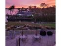 Enjoy outdoor living on this waterfront patio with lounge seating and beautiful views at 516 Tamiami S Trl # 303, Nokomis, FL 34275