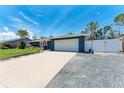 Well-kept single-Gathering home featuring a spacious driveway, two-car garage, and neat landscaping at 5207 5Th Avenue Nw Dr, Bradenton, FL 34209