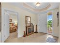 Inviting foyer featuring tile flooring, neutral walls, and access to the main bedroom at 157 Tampa E Ave # 305, Venice, FL 34285