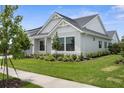 Beautiful home with a manicured lawn and carefully chosen landscaping at 18136 Foxtail Loop, Venice, FL 34293