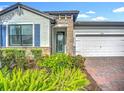 Charming one-story home with brick-paved driveway and well-maintained landscaping at 20749 Swallowtail Ct, Venice, FL 34293