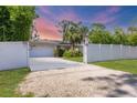 Charming single-story home featuring a manicured front yard and a private fenced entrance for added security at 2445 Apache St, Sarasota, FL 34231