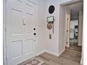 Inviting entryway with a white door and stylish décor, creating a warm and welcoming ambiance at 3340 Webber St, Sarasota, FL 34239