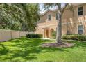 Charming townhome exterior with well-maintained lawn and beautiful landscaping at 3633 Parkridge Cir # 10-201, Sarasota, FL 34243