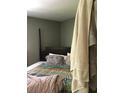 Bedroom with a queen bed and colorful bedding, highlighted by the neutral-colored walls at 3661 Sterling Rd, Venice, FL 34293