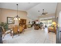 Spacious living room with high ceilings, tile flooring, and large windows, offering lots of natural light at 435 Boundary Blvd, Rotonda West, FL 33947