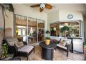 Relaxing covered patio area perfect for outdoor dining or lounging with comfortable seating and pleasant views at 435 Boundary Blvd, Rotonda West, FL 33947